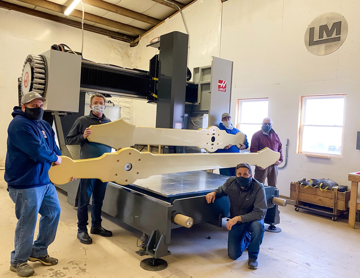 The Lyman-Morse team holds a set of the new clock tower hands